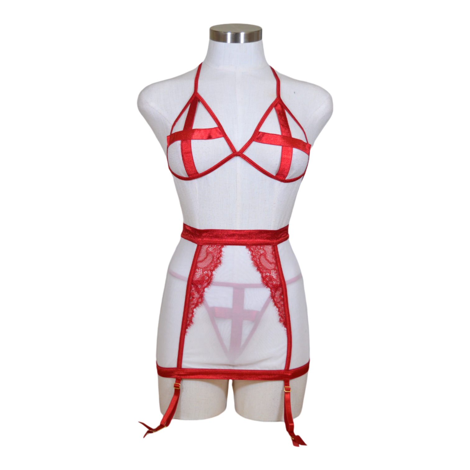A mannequin wearing a red and white satin nurse bra set with a high-waist mesh skirt, a satin elastic thong, and a headpiece.