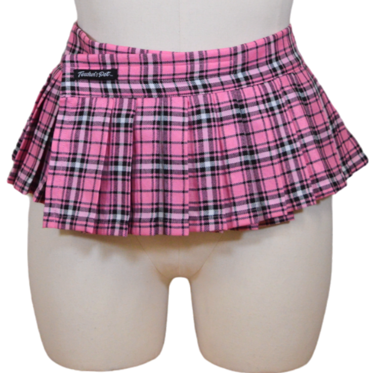 This image features a stylish and playful plaid skirt, perfect for making a fashion statement. Displayed on a mannequin, the skirt boasts a bold pink print with traditional plaid patterns in contrasting colors, emphasizing its trendy and youthful appeal.