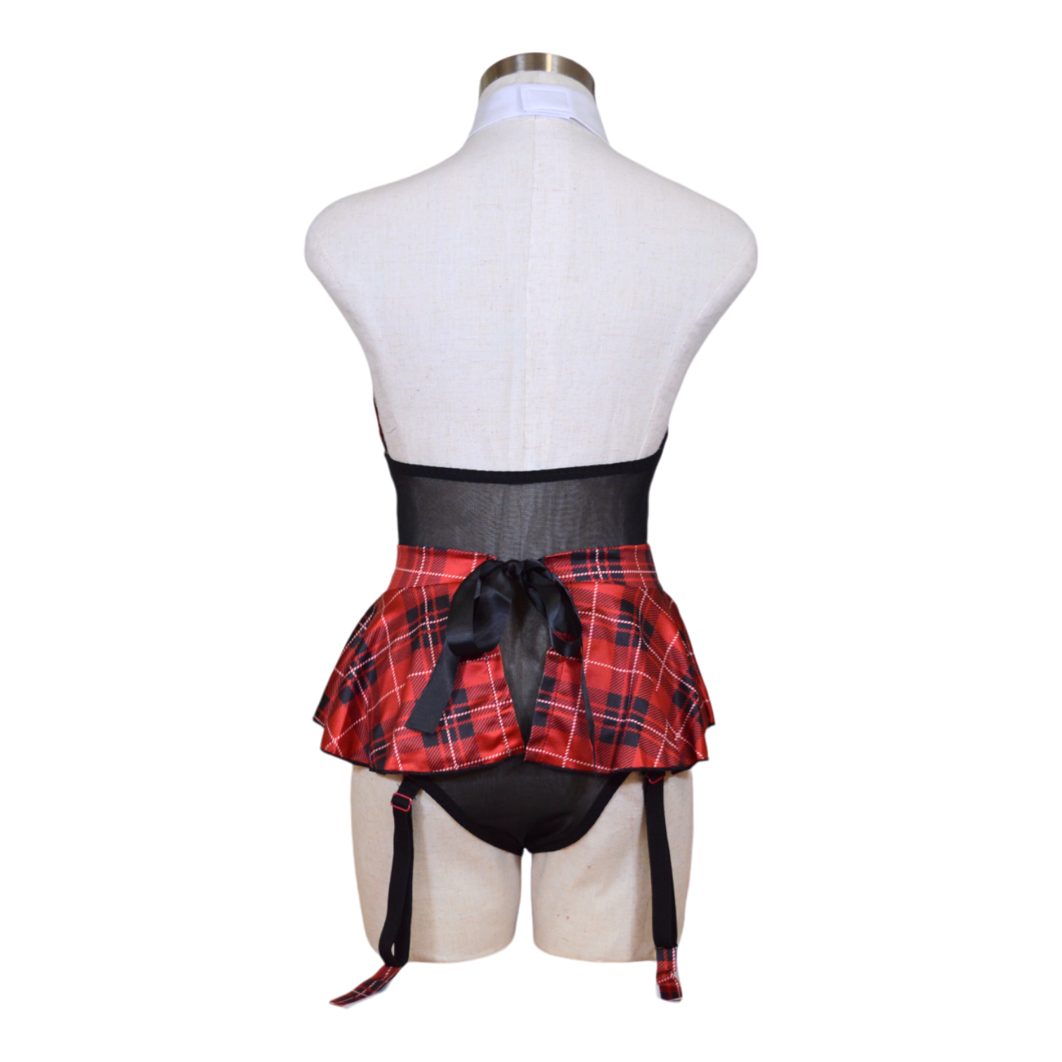 A mannequin wearing a red and black plaid teddy with a halter neck, sheer mesh, a skirt, and garter straps back view.