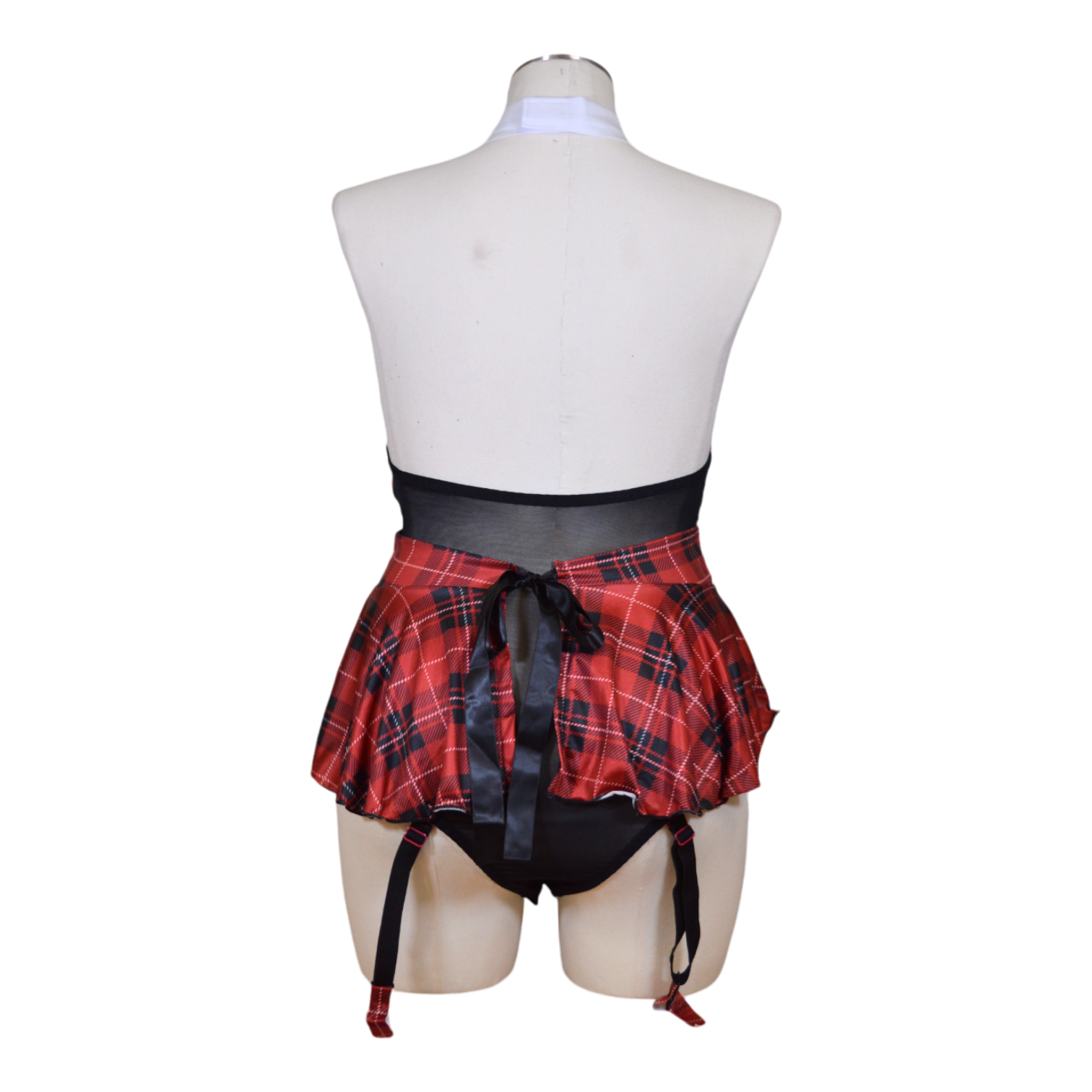 A mannequin wearing a red and black plaid teddy with a halter neck, sheer mesh, a skirt, and garter straps back view.