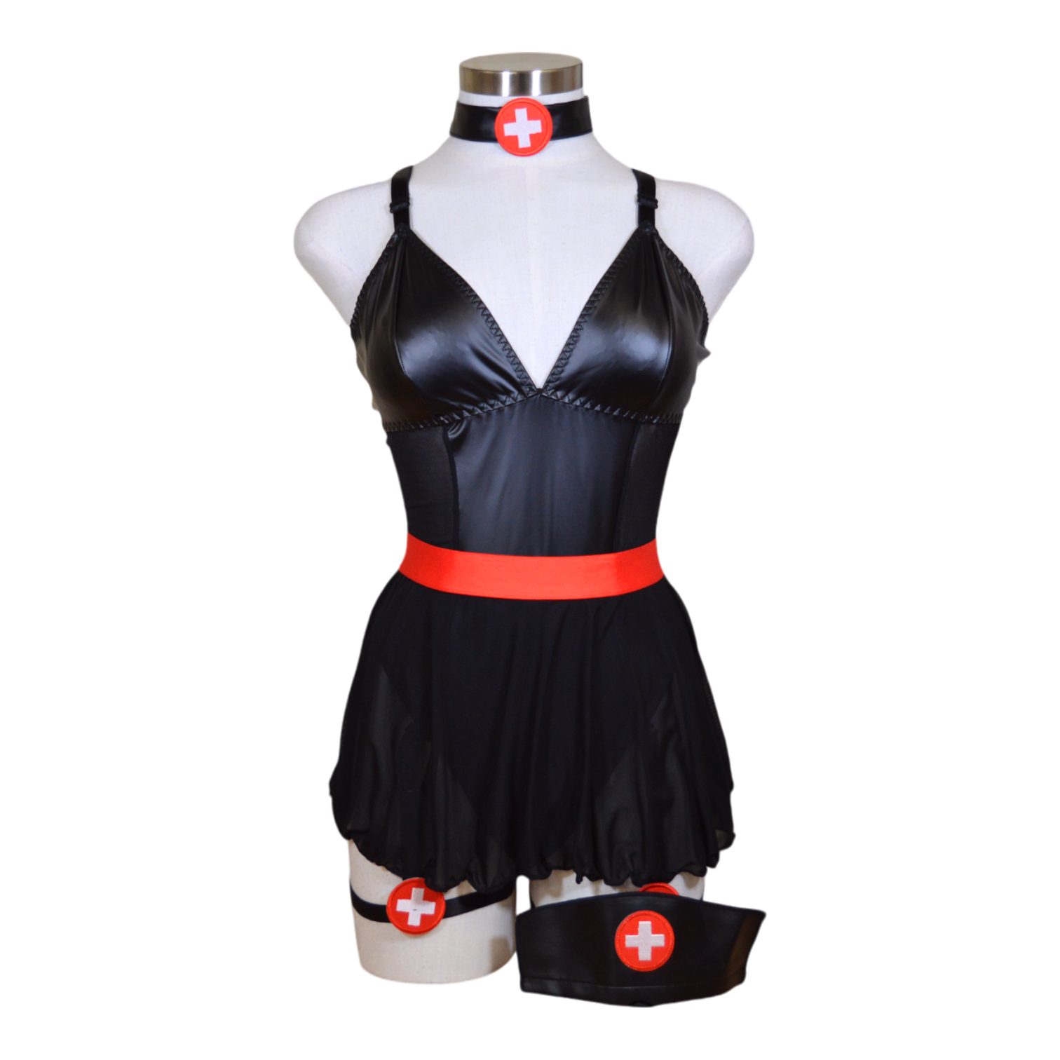 A black leather nurse costume displayed on a mannequin, featuring a revealing dress with red trim, a choker, and garter straps.