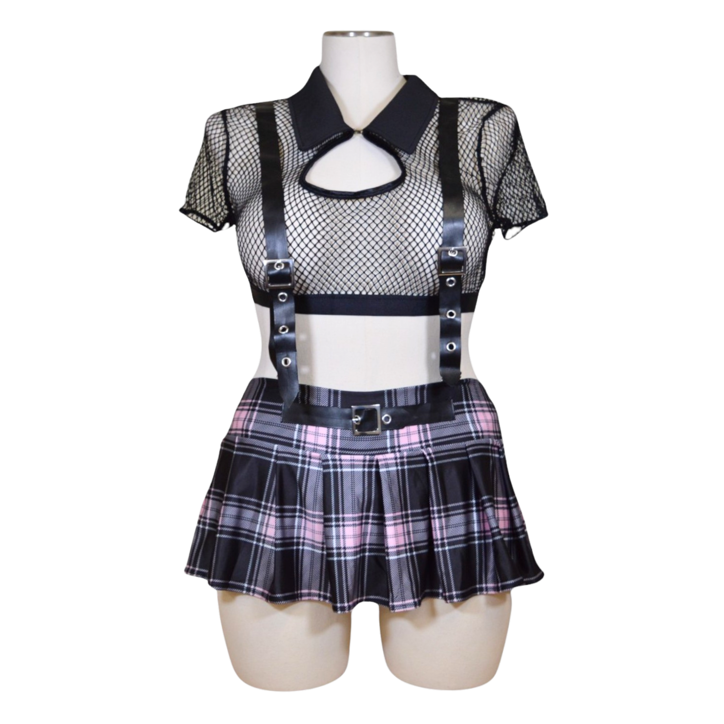 A set of women's lingerie featuring a fishnet crop top with a collared neckline and front button closure, accompanied by a plaid pleated skirt and removable leather suspenders.