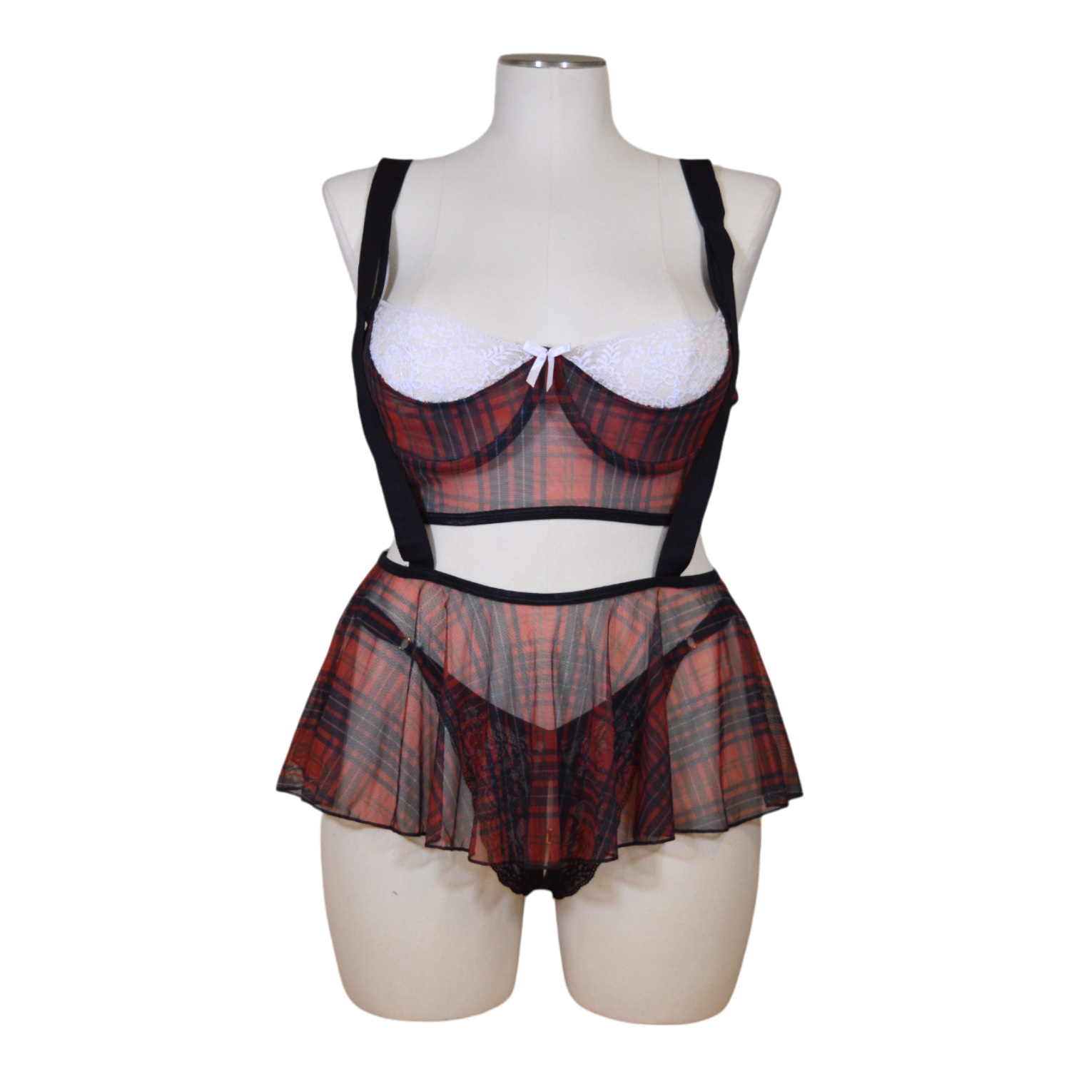 A mannequin displaying a sexy school girl costume set, including a plaid skirt and suspenders on a mannequin.