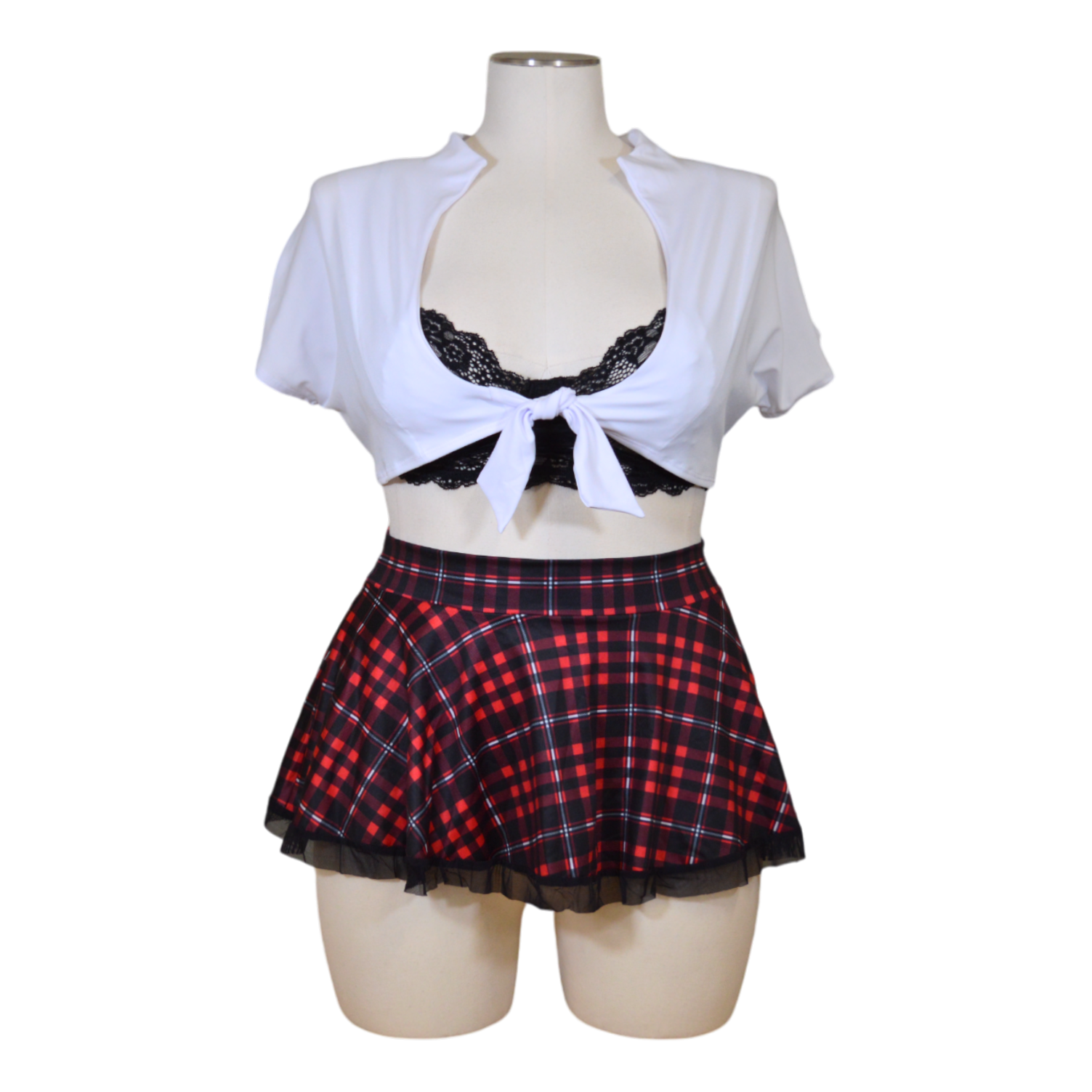 A mannequin wearing a flirty outfit with a lace bra, white tie shirt, and red plaid skirt.