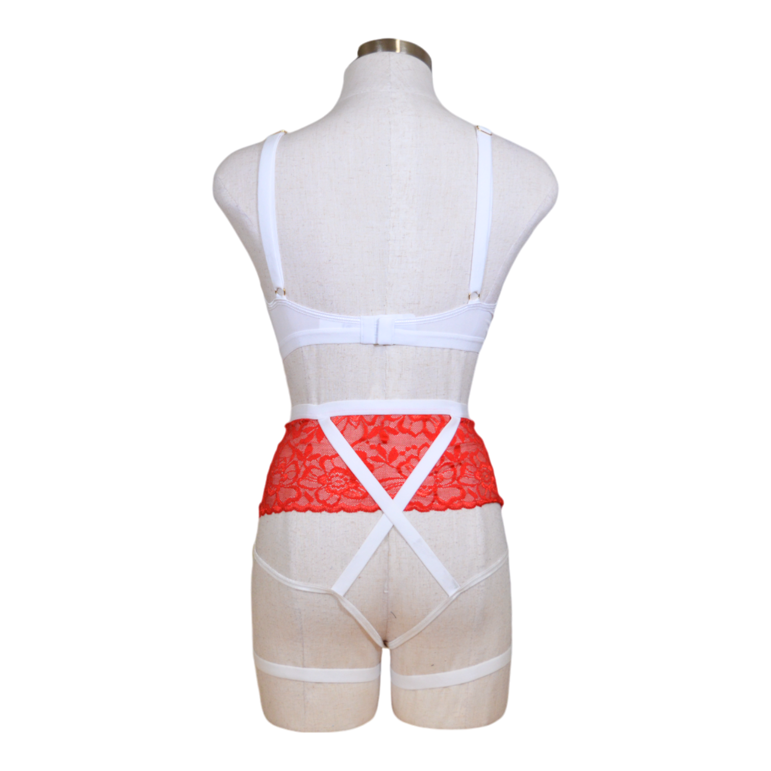 This image displays a seductive nurse costume, perfect for adding a touch of medical romance to your wardrobe. The costume is designed with a white underwire top that features playful red cross detailing, complementing the overall theme.