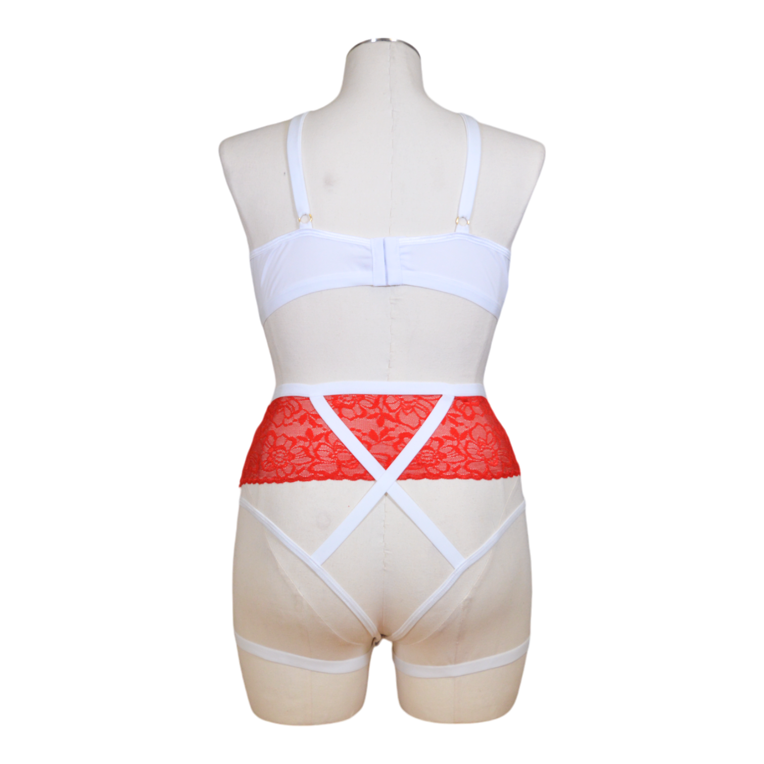 This image displays a seductive nurse costume, perfect for adding a touch of medical romance to your wardrobe. The costume is designed with a white underwire top that features playful red cross detailing, complementing the overall theme.