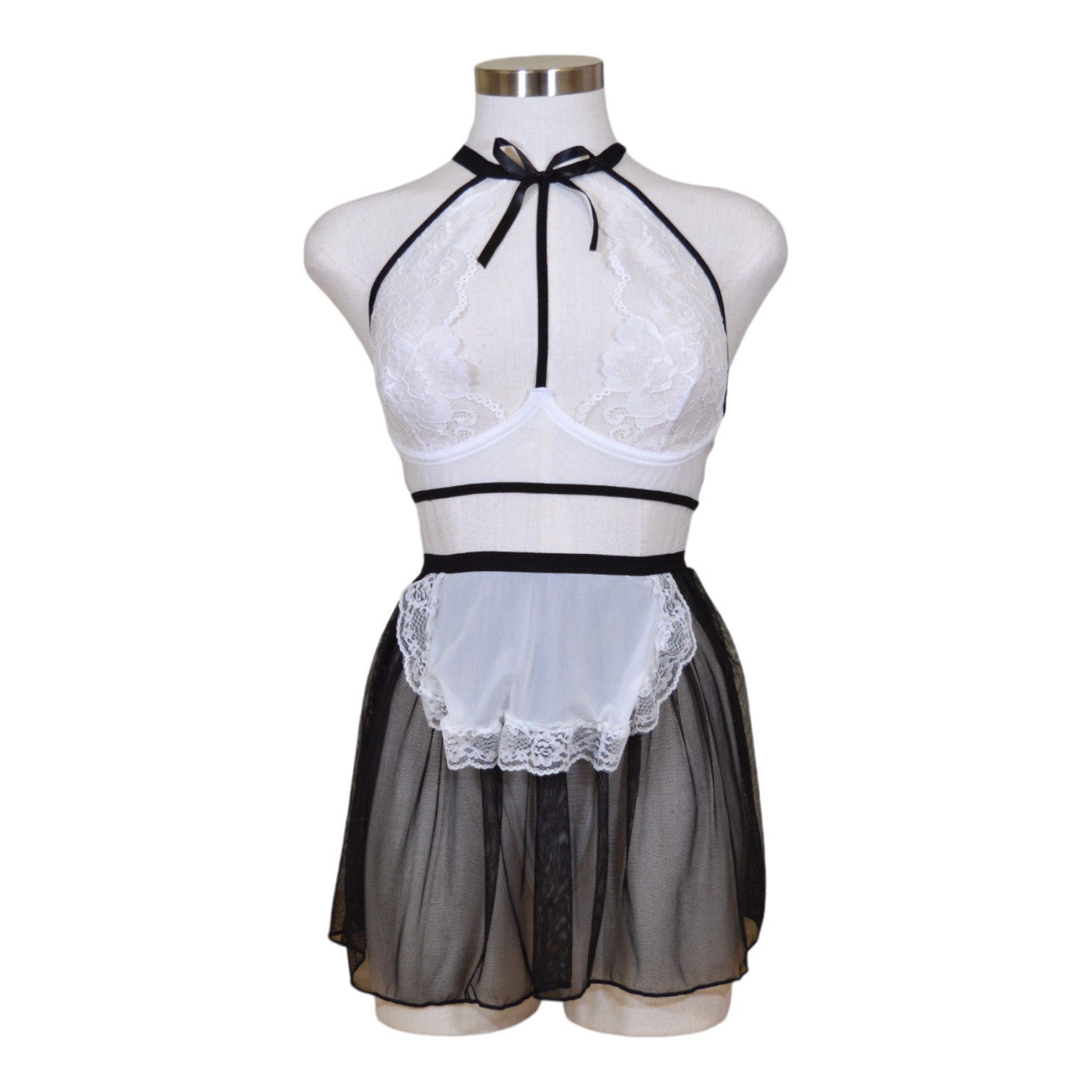 This image features a playful and seductive three-piece lingerie set, presented in a maid-inspired theme. The set includes a white underwired bra with delicate lace detailing and a flirty attached skirt, tied together with a black ribbon at the neck for a charming and flirty look.