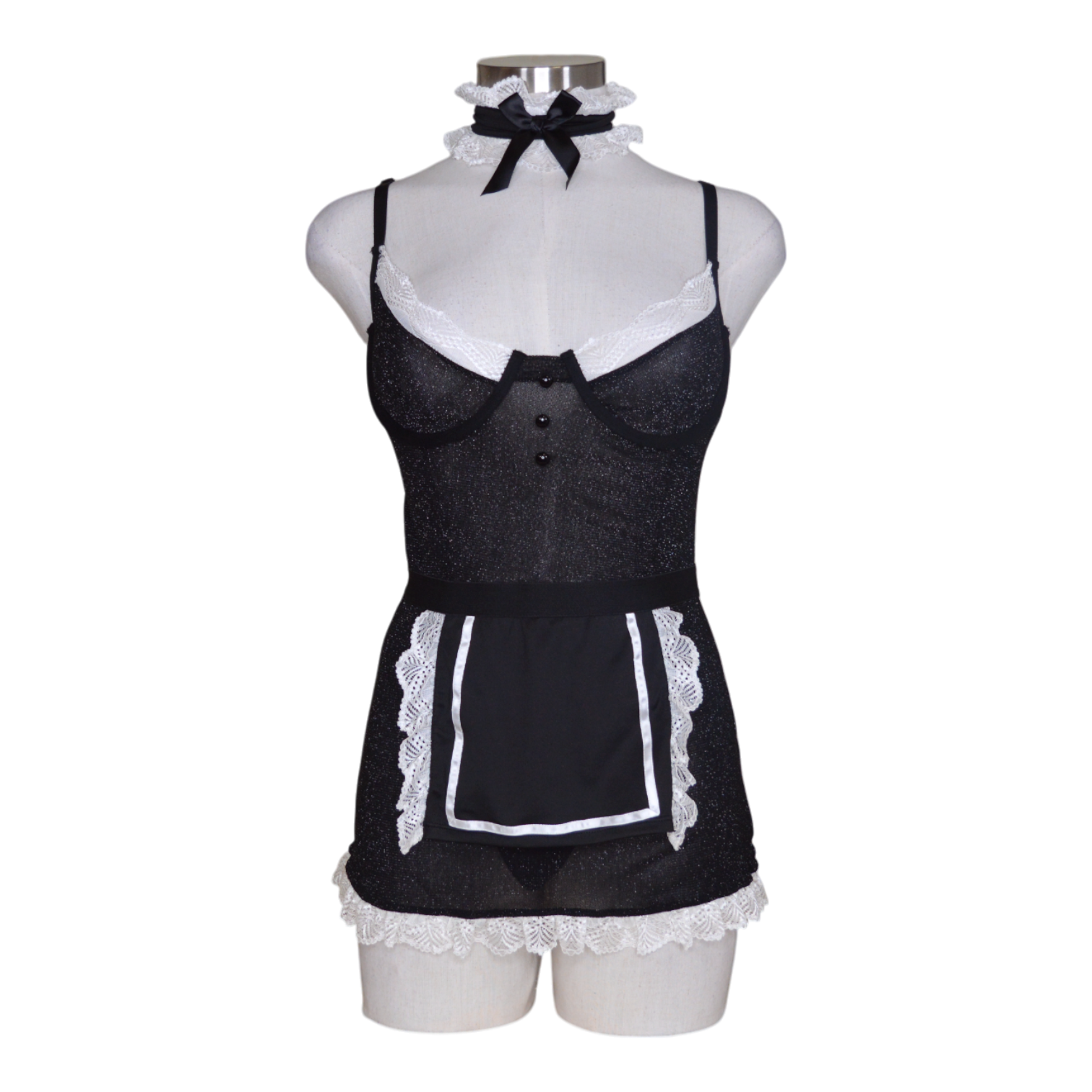 A black and white lingerie set including a chemise with apron detail, underwire cups, hook-and-eye back closure, a G-string panty, and a ruffle choker.