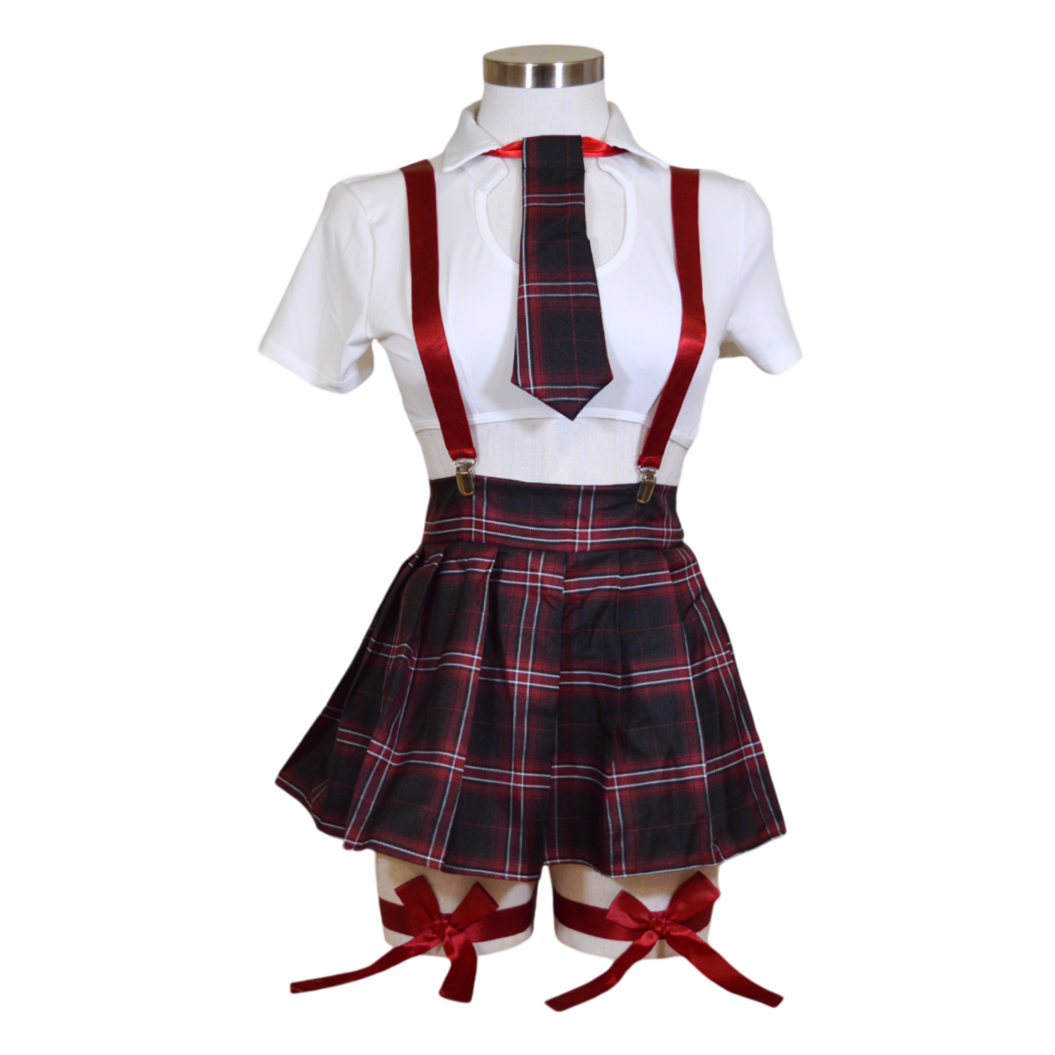 A school girl costume ensemble featuring a white mesh shirt, a plaid skirt, red suspenders, a neck tie, and garter straps with bows.