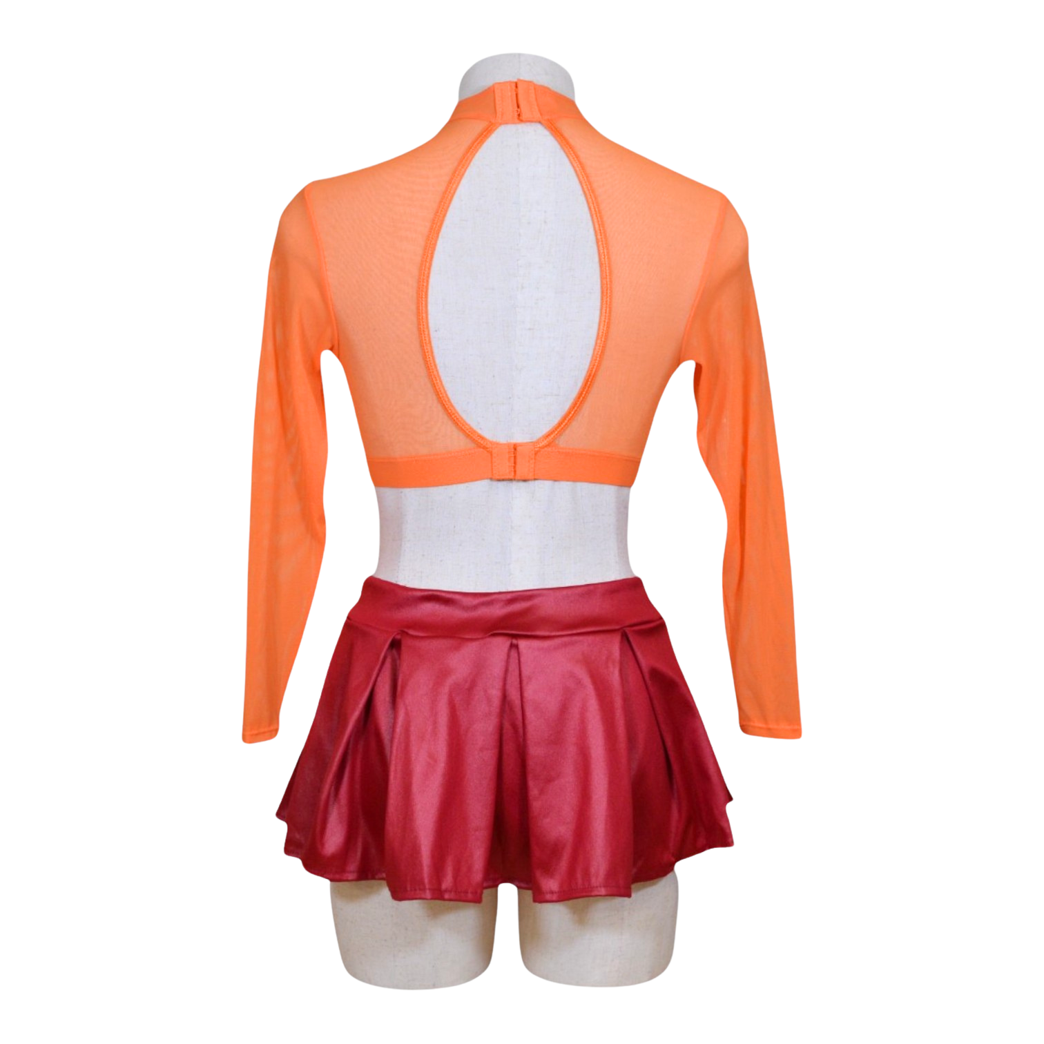 An orange long sleeve crop top with a floral pattern, paired with a red mini skirt, displayed on a mannequin. Also shown are a pair of flower pasties.