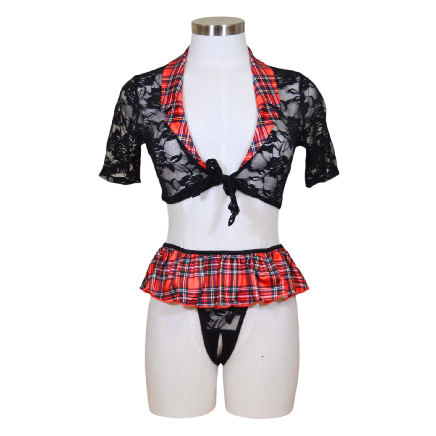 A mannequin showcasing a black lace top and a red and black plaid skirt with a matching lingerie-style thong.